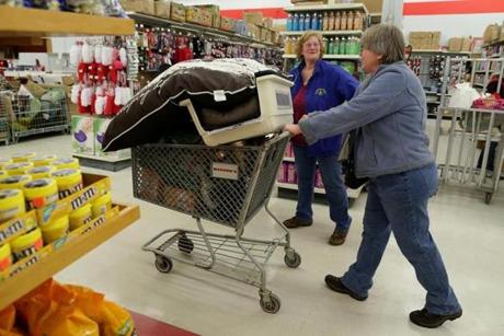 Lynette Carrier (left) and Debbie Williams shopped at Marden?s Surplus & Salvage Store in Scarborough, Maine.
