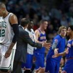 Boston, MA 1-18-17: The Celtics Al Horford (42,left) heads for the bench after a shot hit by the Knicks Derrick Rose (25,backround right be greted by teammates) put New York ahead 112-100 and forced Boston to call a timeout. The Boston Celtics hosted the New York Knicks in a regular season NBA basketball game at the TD Garden. (Globe Staff Photo/Jim Davis) reporter:himmelsbach topic: celtic-knicks