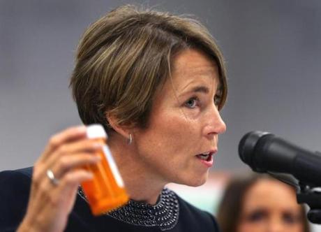 Boston-09/01/2016- Attorney General Maura Healey holds a CVS prescription bottle as she announced in a first-in-the-nation settlement, that CVS Pharmacy will strengthen its policies and procedures around the dispensing of opiods. They will have to check the Prescription Monitoring Program before filling prescriptions for commoly misused opioids.Boston Globe staff photo by John Tlumacki(metro)
