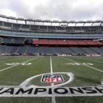 Fred Fletcher, field superintendent, applied the finishing touches to the logo at Gillette Stadium in Foxborough where the New England Patriots will host the Pittsburgh Steelers Sunday in the AFC Championship game this Sunday.