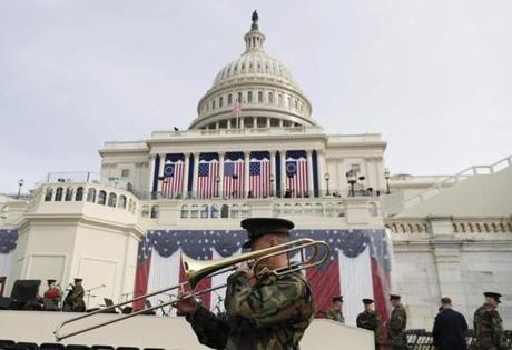 epa05731971 A member of the Marine Corps Band plays a trombone beneath the US Capitol during a rehearsal a day before Donald J. Trump is sworn in as the 45th President of the United States in Washington, DC, USA, 19 January 2017. Trump won the 08 November 2016 election to become the next US President. EPA/SHAWN THEW
