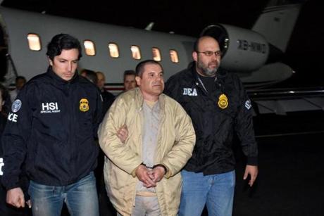 In this photo provided U.S. law enforcement, authorities escort Joaquin 