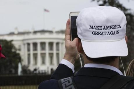 A man photographs the White House in Washington, Thursday, jan. 19, 2017, ahead of Friday's inauguration of Donald Trump. (AP Photo/Matt Rourke)

