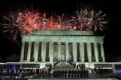 Fireworks explode over the Lincoln Memorial after a welcome celebration for US President-elect Donald Trump in Washington, DC, on January 19, 2017. / AFP PHOTO / Brendan SmialowskiBRENDAN SMIALOWSKI/AFP/Getty Images
