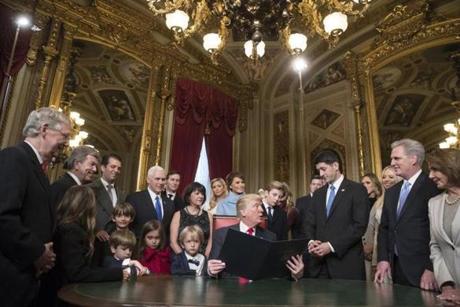 President Donald Trump turned to House Speaker Paul Ryan as he was joined by the Congressional leadership and his family as he formally signs his cabinet nominations into law.
