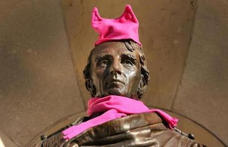 Boston-01/21/2017 Thousands of people filled Boston Common for the Boston Women's March for America. Someone adorned the statue of William Ellery Channing with a pink knit hat and scarf. The staue is on Arlington Street at the Boston Public Garden. John Tlumacki/Globe Staff(metro)
