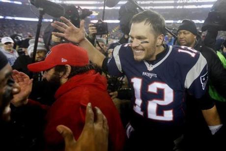 Foxborough, MA - 1/22/2017 - Tom Brady celebrates with teammates after the victory. The New England Patriots host the Pittsburgh Steelers in the AFC Championship game at Gillette Stadium in Foxborough, Mass., on Jan. 22, 2017. (Stan Grossfeld/Globe Staff)
