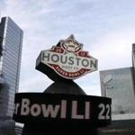 This Jan. 14, 2017 photo shows a countdown sign leading up to Super Bowl LI in Discovery Green park in downtown Houston. Super Bowl LI will be played Feb. 5 at NRG Stadium in Houston. (AP Photo/David J. Phillip)