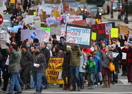 Boston-01/27/2017 Close to a thousand people march onto Kneeland street stepping off from a rally at the Chinatown Gate, in protest to new immigration rules by President Trump. They ended up at the State House. John Tlumacki/Globe Staff(metro)
