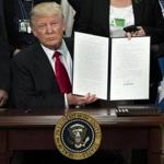 FILE-- President Donald Trump after signing an executive action that will order the construction of a Mexican border wall, at the Department of Homeland Security in Washington, Jan. 25, 2017. A flurry of edicts from the Trump White House puts some Republicans in an awkward position after they castigated former President Barack Obama for using the same approach. (Doug Mills/The New York Times)