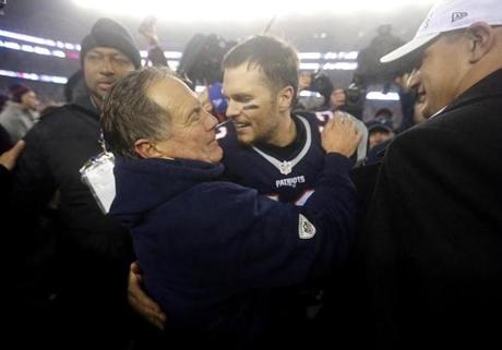 Foxborough, MA - 1/22/2017 - Bill Belichick and Tom Brady celebrate after the victory. Rob Gronkowski at right. The New England Patriots host the Pittsburgh Steelers in the AFC Championship game at Gillette Stadium in Foxborough, Mass., on Jan. 22, 2017. (Stan Grossfeld/Globe Staff)
