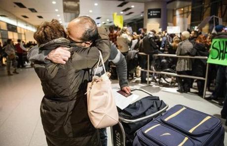 Baharak Bahmani greeted her husband Hamed Hosseini-Bay at Boston?s Logan Airport after he was held for hours after his flight from Iran.
