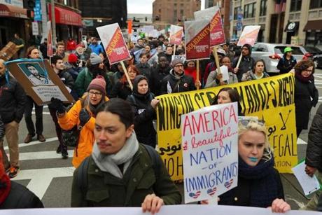 Demonstrators were in downtown Boston on Saturday protesting against President Trump?s immigration rules.
