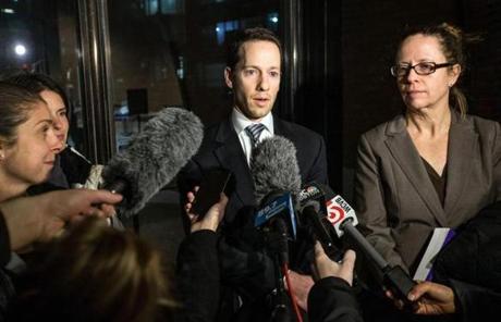 Matthew Segal (center) of the ACLU addressed the media early Sunday at the federal courthouse.
