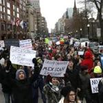 Protesters marched from Copley Square to the State House to protest President Trump's executive order on immigration.