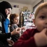 Mahasen Khatib, a Syrian refugee who is settling her family in Rutland, Vt., after months in Turkey, fed Dania, 5, one of her children. 