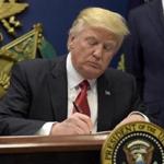 President Donald Trump signed an executive order severely limiting immigration from seven Muslim-majority nations on Friday.