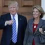FILE - In this Nov. 19, 2016 file photo, President-elect Donald Trump stands with Education Secretary-designate Betsy DeVos in Bedminster, N.J. Charter school advocate and wealthy Republican donor Betsy DeVos is widely expected to push for expanding school choice programs if confirmed as education secretary, causing outrage among teachersâ?? unions. But Democrats and rights activists also are raising concerns about how her conservative Christian beliefs and advocacy for family values might impact minority and LGBT students. (AP Photo/Carolyn Kaster, File)