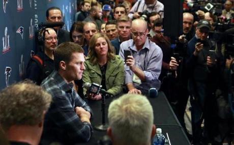 A somber Tom Brady was surrounded by reporters Tuesday at the Patriots? team hotel.

