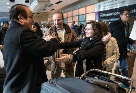 Ali Reza Jalili (left) greeted his niece Helia Jalili at Logan Airport on Sunday.
