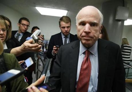 Senator John McCain was trailed by reporters while walking to the Senate Chamber on Jan. 31.
