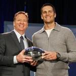 NFL commissioner Roger Goodell and New England Patriots quarterback Tom Brady pose with the MVP trophy during a news conference after the NFL Super Bowl 51 football game Monday, Feb. 6, 2017, in Houston. Brady was named the MVP of Super Bowl 51. (AP Photo/David J. Phillip)