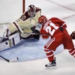 Boston College goalie Joseph Woll makes a save on a shot by Boston University forward Patrick Harper during the first period of a Beanpot hockey tournament game in Boston, Monday, Feb. 6, 2017. (AP Photo/Charles Krupa)