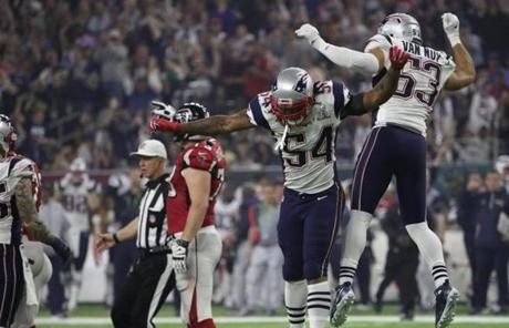 Dont?a Hightower and Kyle Van Noy celebrated.
