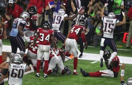 The Patriots celebrated scoring to win the game.
