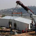 Prefabricated houses were removed from the closed Israeli settlement in Amona, in the occupied West Bank, on Monday. 