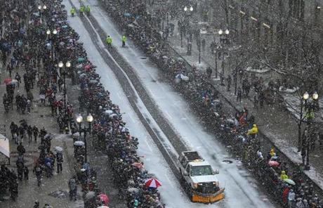 Boston-02/07/2017 . A plow makes it's way down Boylston Street moments before the start of The New England Patriots duck boat parade down Boylston Street, as thousands of fans lined the route. John Tlumacki/The Boston Globe(metro) New England Patriots Super Bowl Parade 2017
