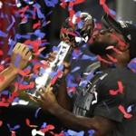 Patriots running back James White kissed the Lombardi Trophy after the Patriots won the Super Bowl Saturday.