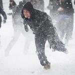 Boston, MA - 2/9/2017 - A man reacts to being hit by a snowball during a snowball fight in the Boston Common in Boston, MA, February 9, 2017. A winter storm is expected to drop between 12 to 18 inches of snow in the region, with less falling towards the Cape and Islands, according to National Weather Service.(Keith Bedford/Globe Staff)