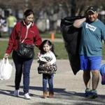 Catalina Rosales, from left, her daughter Kelly, 3, and husband Armando, of Gridley, Calif., leave a shelter after a mandatory evacuation was lifted Tuesday, Feb. 14, 2017, in Chico, Calif. Authorities lifted an evacuation order Tuesday for thousands of California residents who live below the nation's tallest dam after declaring that the risk of catastrophic collapse of a damaged spillway had been significantly reduced. (AP Photo/Marcio Jose Sanchez)