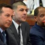 Aaron Hernandez (center) listened to the judge during pretrial hearings Monday.