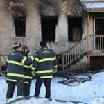 Firefighters worked at the scene of a fatal three-alarm fire in Lowell. 