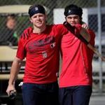 Fort Myers, FL - 2/16/2017 - Boston Red Sox left fielder Brock Holt and Boston Red Sox left fielder Andrew Benintendi play to the cameras as they head back to the Sox clubhouse after taking indoor batting practice. Red Sox Spring Training. Day Four. Physicals and informal workout for Red Sox position players at Jet Blue Park in Fort Myers, FL. - (Barry Chin/Globe Staff), Section: Sports, Reporter: Peter Abraham, Topic: 17Red Sox, LOID: 8.3.1649046056.
