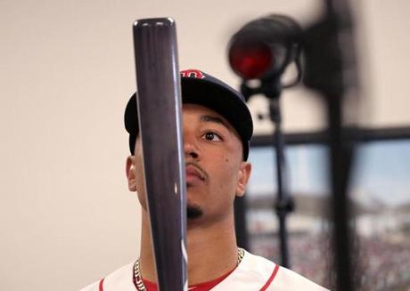 Fort Myers, FL - 2/19/2017 - Boston Red Sox right fielder Mookie Betts (50) examines his bat as he gets ready to have his photo taken for picture day before today's workouts. Red Sox Spring Training. Picture Day and workouts. Day Seven at Jet Blue Park in Fort Myers, FL. - (Barry Chin/Globe Staff), Section: Sports, Reporter: Peter Abraham, Topic: 20Red Sox, LOID: 8.3.1649046304.
