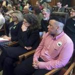 Kenzo Morris, right, listens during a public hearing on a bill that would bar discrimination based on gender identity on Tuesday in Concord, N.H. 