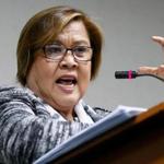 FILE - In this Feb. 21, 2017 file photo, Philippine Senator Leila de Lima gestures during a postponed news conference at the Philippine Senate in suburban Pasay city, south of Manila, Philippines. De Lima, a Philippine opposition senator and leading critic of President Rodrigo Duterte's deadly anti-drug crackdown was arrested Friday, Feb. 24 on drug charges but professed her innocence and vowed she would not get cowed by a leader she called a 