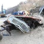 This aged Jeep Wagoneer was plucked from its unintended burial plot along Ballston Beach, in Truro. 