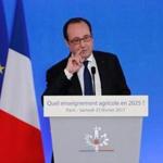 French President Francois Hollande delivers a speech as he visits the International Agricultural fair in Paris, on February 25, 2017. French President Francois Hollande on February 25, 2017, hit back at Donald Trump after the US president criticised France in a veiled attack on its immigration policies and those of its European allies. 