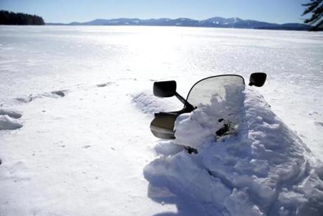 The snowmobile ridden by Steven Weiss, who managed to make it to shore when his machine broke through the ice. The two friends with him drowned.
