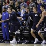 BYU players jumped off the bench after upsetting Gonzaga on Saturday.