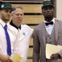 Danny Ainge, Boston Celtics president of basketball operations, talks with Celtics draft picks Abdel Nader, left, of Egypt, and Ben Bentil, of Ghana, right, after an introductory news conference Friday, June 24, 2016, in Waltham, Mass. (AP Photo/Elise Amendola)