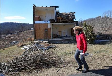 Jeanie Thomas walked past of the front of her home on Whately Road in Conway.
