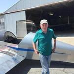 A copy photo of Alan Lavendar standing next to his Jabiru 3300 powered, standard gear Sonex (S/N 1589) that he flew for the first time last May.