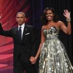 FILE - This Sept. 17, 2016 file photo shows President Barack Obama and first lady Michelle Obama at the Congressional Black Caucus Foundation's 46th Annual Legislative Conference Phoenix Awards Dinner in Washington. The former president and first lady have signed with Penguin Random House, the publisher announced Tuesday, Feb. 28, 2017. (AP Photo/Pablo Martinez Monsivais, File)