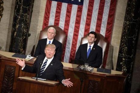 US Vice President Mike Pence (L) and Speaker of the House Paul Ryan (R-WI) (R) listen as US President Donald Trump speaks during a joint session of Congress on Capitol Hill February 28, 2017 in Washington, DC. / AFP / Brendan Smialowski (Photo credit should read BRENDAN SMIALOWSKI/AFP/Getty Images)

