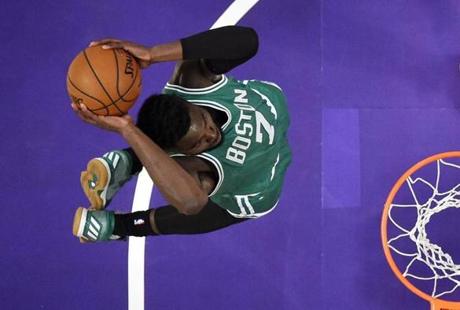 Boston Celtics forward Jaylen Brown goes in for a dunk during the first half of the team's NBA basketball game against the Los Angeles Lakers, Friday, March 3, 2017, in Los Angeles. (AP Photo/Mark J. Terrill)
